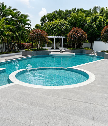 Resort-style pool with deck loungers
